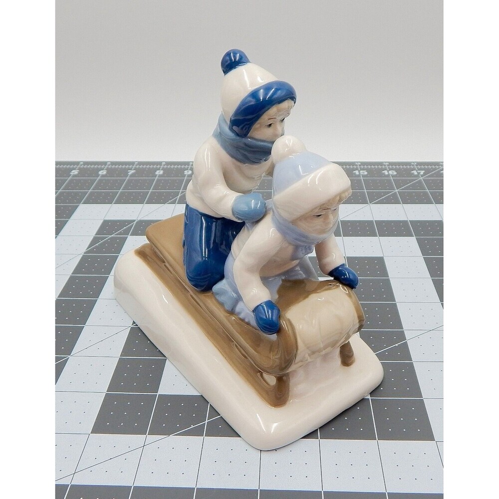 Porcelana De Cuernavaca Paul Sabastian Children Sledding Porcelain Figurine